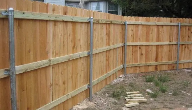 Cedar privacy fence on galvanized steel posts built by Tucker Built Co